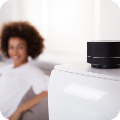Woman with speaker in foreground
